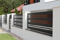 a white fence with wooden slats on it