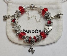 AUTHENTIC Pandora Barrel Clasp Bracelet  and come with a receipt. While I use high quality beads and charms on the Pandora bracelet,  the charms and beads used on the bracelet are NOT Pandora Brand, making the bracelet very affordable.  Beads and charms include: Red single core diamond faceted beads, crystal beads. Cupid charm, I Love You bead, Kissing Couple charm, 4ever bead, Bear Heart bead Includes  Security Chain, Clasp Bead, Gift box and ships USPS Priority Mail Pandora Bracelet Shown is  7.9 with barrel clasp Per Pandora  Make your jewelry the last thing you put on in the morning and first thing you take off at night. High & Dry Remove jewelry prior to swimming, bathing and other sporting/physical activities and limit contact with make-up, creams, perfume and lotions. Cute Christmas Gifts For Girlfriend, Red Pandora Bracelet, Pandora Christmas Bracelet, Pink Themed Pandora Bracelet, Themed Pandora Bracelet, Red Pandora Charms, Red Theme Pandora Bracelet, Valentines Pandora Bracelet, Baddie Pandora Bracelet