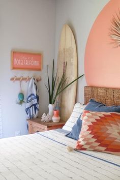 a bedroom with surfboards on the wall