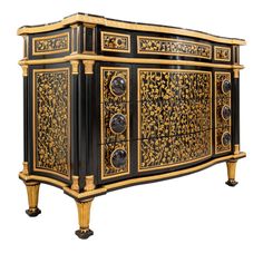 an ornate black and gold sideboard with two drawers on each side, one door open