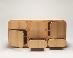 a wooden shelf with several compartments on it