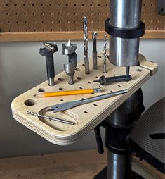 tools are arranged on a workbench with screwdrivers