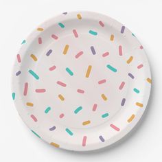 a paper plate with sprinkles on it