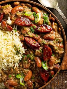 a bowl filled with rice, beans and sausage