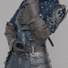 a close up of a person wearing armor