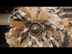 a close up of a burlock on a doorknob that is covered in fabric