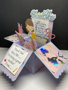 an origami card box with some cards in it