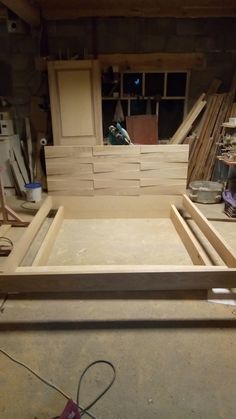 an unfinished bed frame in the process of being built