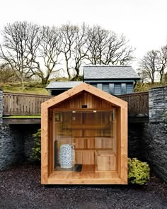 a wooden sauna in the middle of a yard