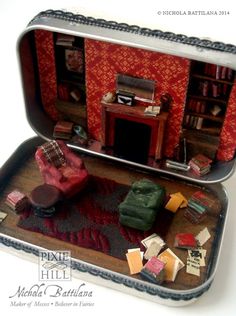 an open tin can filled with miniature furniture