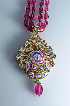 Jewelove Masterpiece This is one of our most exceptional pieces. A two-sided diamond polki & enamel pendant which took us months to create. This pendant by Jewelove showcases the exquisite craftsmanship of Meenakari (enamelling) for which the were invited to Jaipur by the founder King of Jaipur & for which the are most well known. The image that you see above is supposedly the front side of the pendant, which has an array of diamond polkis in the center with two peacock birds on top enli Luxury Meenakari Sets In Dola Silk, Luxury Fusion Meenakari Jewelry Sets, Luxury Round Stone Work Jewelry, Luxury Blue Meenakari Jewelry, Luxury Meenakari Fusion Jewelry Sets, Luxury Bollywood Jewelry With Meenakari Details, Luxury Meenakari Jewelry For Festive Occasions, Luxury Meenakari Jewelry For Festive Season, Jaipur Jewelry Diamond