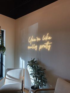 there is a neon sign that says you're like really pretty on the wall