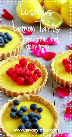 lemon tarts with raspberries and blueberries on top