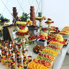 a table filled with lots of different types of fruit on top of eachother