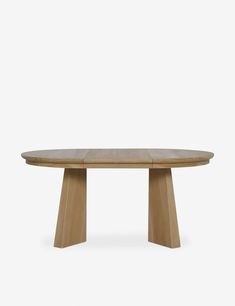 an oval wooden table with three legs