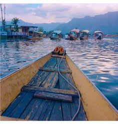 there are many boats floating on the water