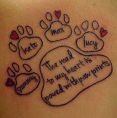 a tattoo with two paw prints on it and the words i love you in cursive