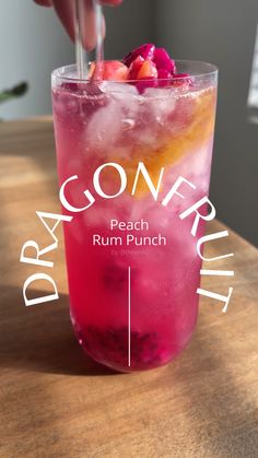 a person holding a strawberries and orange drink with the words don't peach rum punch on it