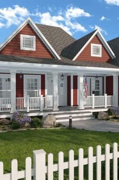 this is an artist's rendering of the cottage style home in red and white