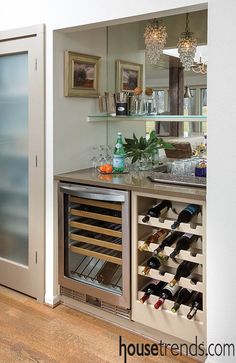 a wine rack in the middle of a kitchen