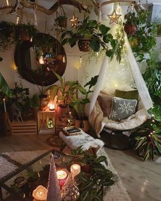 a living room filled with lots of plants and candles