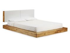 the bed frame is made from wood and has white sheets