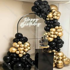 a black and gold birthday party with balloons