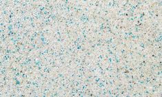 an image of blue and white speckles on concrete