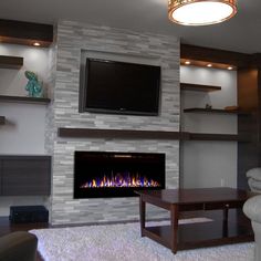 a living room with a fireplace and tv above the fire place in front of it