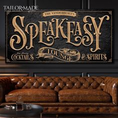 a leather couch sitting in front of a wooden sign that says speakeasy lounge and spirits