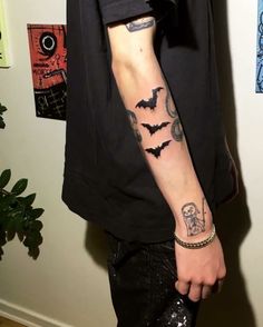 a man with a tattoo on his arm