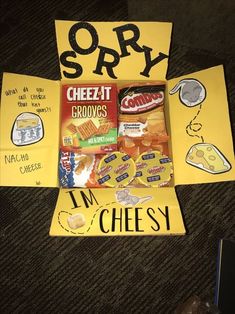 an assortment of snacks is displayed on a bulletin board with words that spell out sorry, cheetos and i'm cheesy