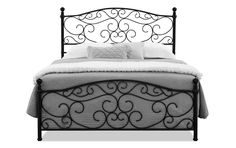 a black iron bed frame with white sheets and pillows on the headboard, against a white background