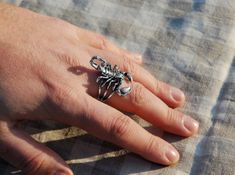 The Scorpio sterling silver jewelry men ring accurately conveys the shape of a real scorpion. The biker mens ring is quite massive, so carefully study zodiac rings characteristics - width and weight. You will also find a scorpion pendant in my catalog: https://www.etsy.com/listing/616061915 Weight: 8-10 g. Width 3.7 cm. (1.45 in) and 0.5 cm. (0.19 in) Jewelry Men Ring, Silver Jewelry Men, Scorpion Jewelry, Real Scorpion, Scorpion Ring, Mens Sterling Silver Jewelry, Armor Ring, Zodiac Rings, Silver Rings Simple