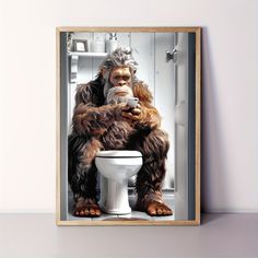 an oranguel is sitting on top of a toilet and drinking from a cup