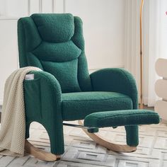 a green rocking chair and footstool in a room with white rugs on the floor