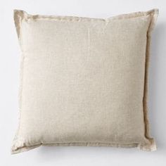 a beige pillow with ruffled edges on a white background, it is made from linen