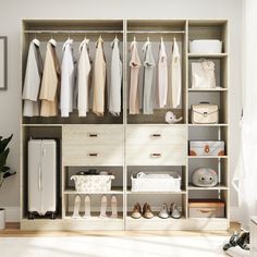 an organized closet with clothes and shoes