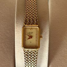 Vintage Citizen Quartz Gold Watch 1980’s Textured / Embossed Gold Plated Bracelet With Fold Over Clasp Tank Style Watch - Face Is 1/2” Wide And 5/8” Height Movement: Quartz Assembled: Frankfurt Germany Case Material: Stainless Steel Vintage: 1985 Size: 6 ½” (Adjust To 6 ¾” Larger, If Needed) Can Easily Be Sized Down Too Gently Worn And In Good Working Condition! Does Not Come In The Original Box. Beautiful Addition To Your Watch Collection! Petite, Classic, Sophisticated Yet Understated. Not Shi Gold Vintage Watch, Tank Watch, Frankfurt Germany, Vintage Tank, Style Watch, Gold Plated Bracelets, Watch Faces, Watch Collection, 14kt Gold