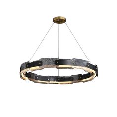 a large circular light fixture with metal rings and black leather straps on the bottom, hanging from