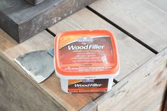 a wood filler sitting on top of a wooden table