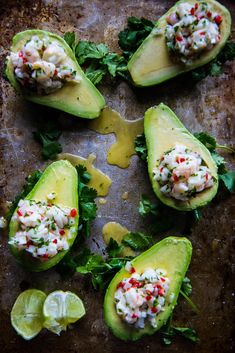 avocados stuffed with crab salad and garnished with cilantro sauce