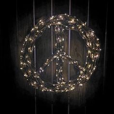 a peace sign made out of string lights