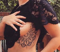 a woman with a tattoo on her stomach