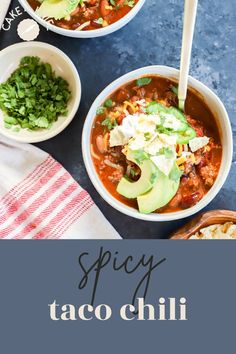 two bowls of spicy taco chili with avocado and cilantro on the side