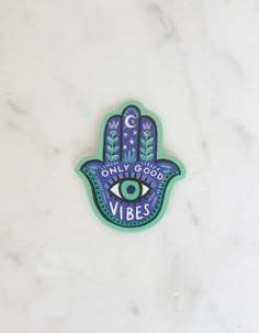 a sticker with the words only good vibes in front of an evil eye