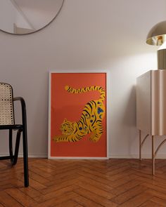 an orange and yellow tiger print on a wall next to a black chair in a white room