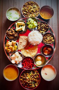 an overhead view of many different foods on a plate with sauces and condiments