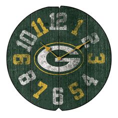 the green bay packers clock is made from wood and has numbers on each side of it