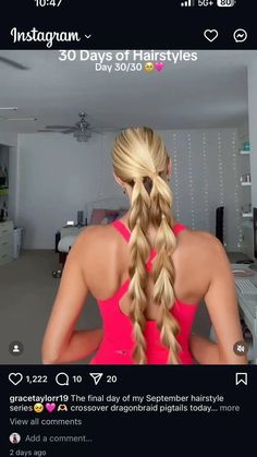 a woman with long blonde hair in a pink tank top and fishtail braids